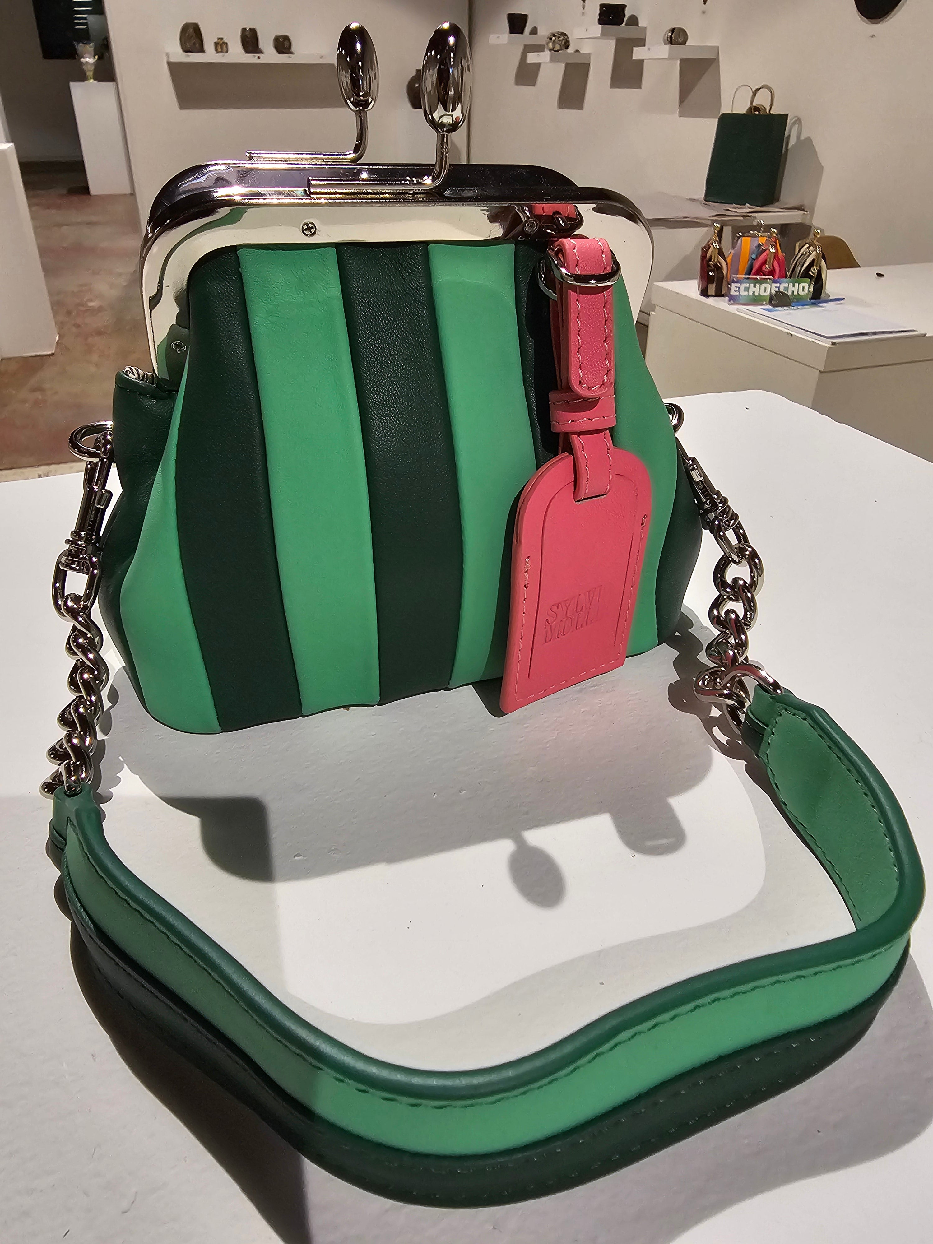 The Lil Fannie mini bag in two-tone green leather with a gold kiss-lock frame