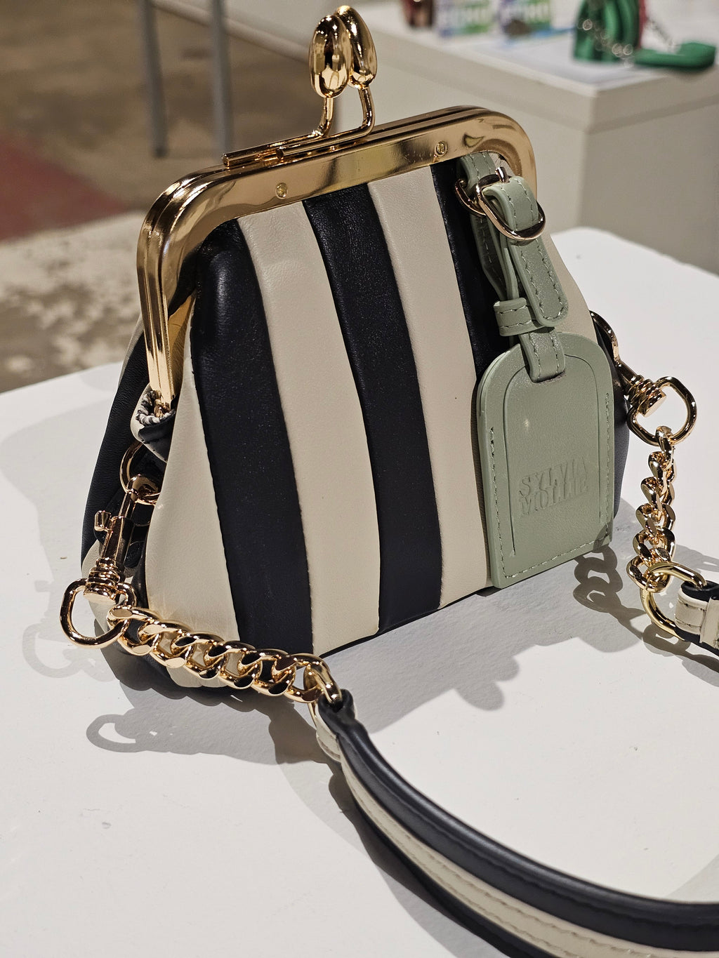 Black and ecru striped mini leather bag by Sylvia Mollie