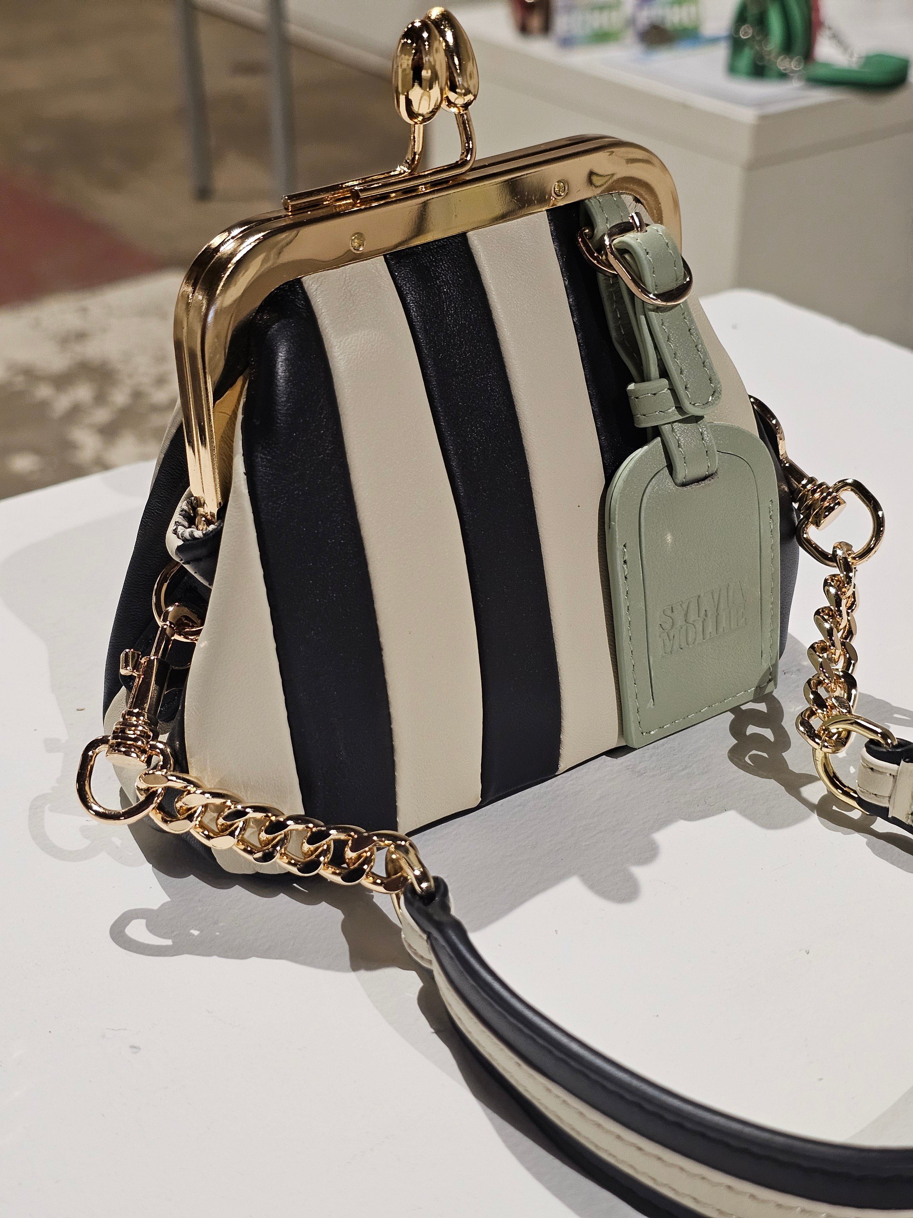 Black and ecru striped mini leather bag by Sylvia Mollie
