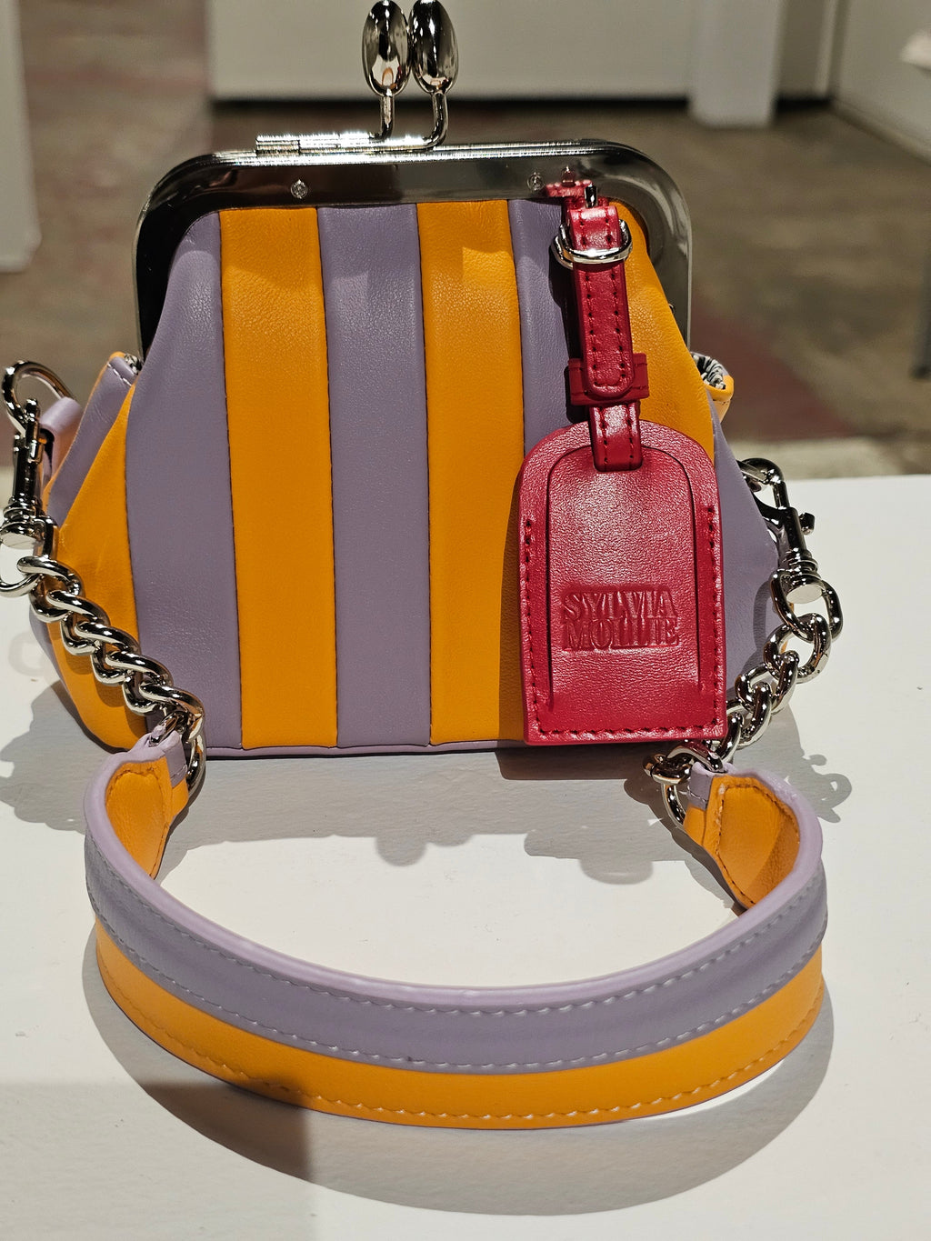 The Daisy Mae Lil Fannie with a red leather hangtag