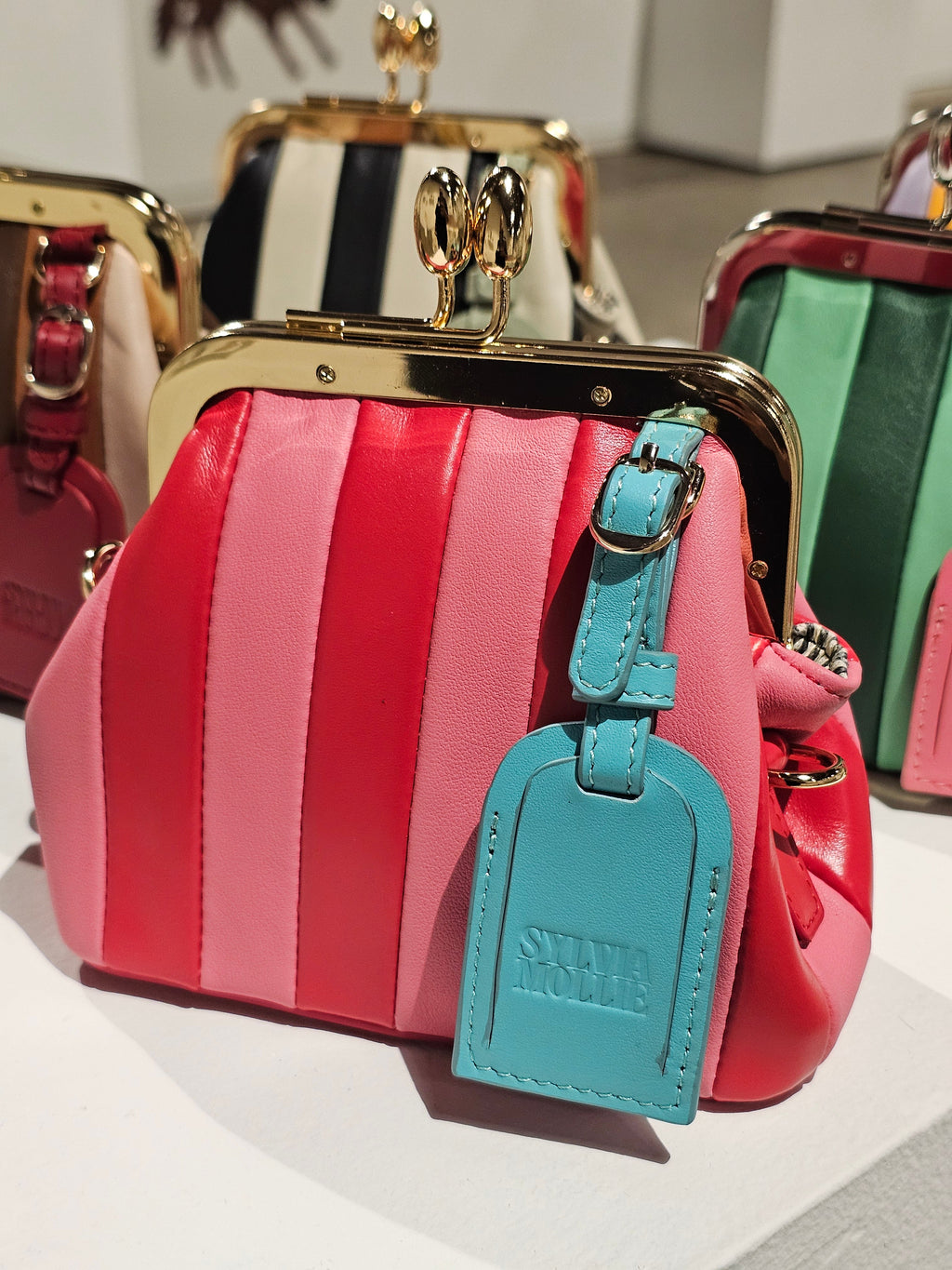 Red and pink Lil Fannie mini kiss-lock bag