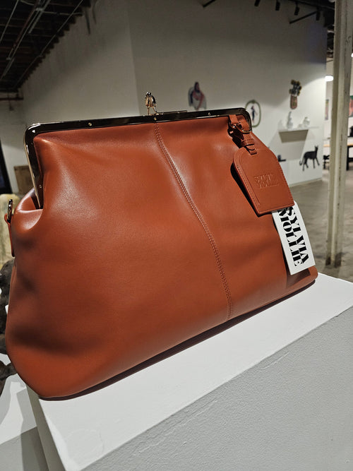 Cognac leather kiss-lock handbag by Sylvia Mollie