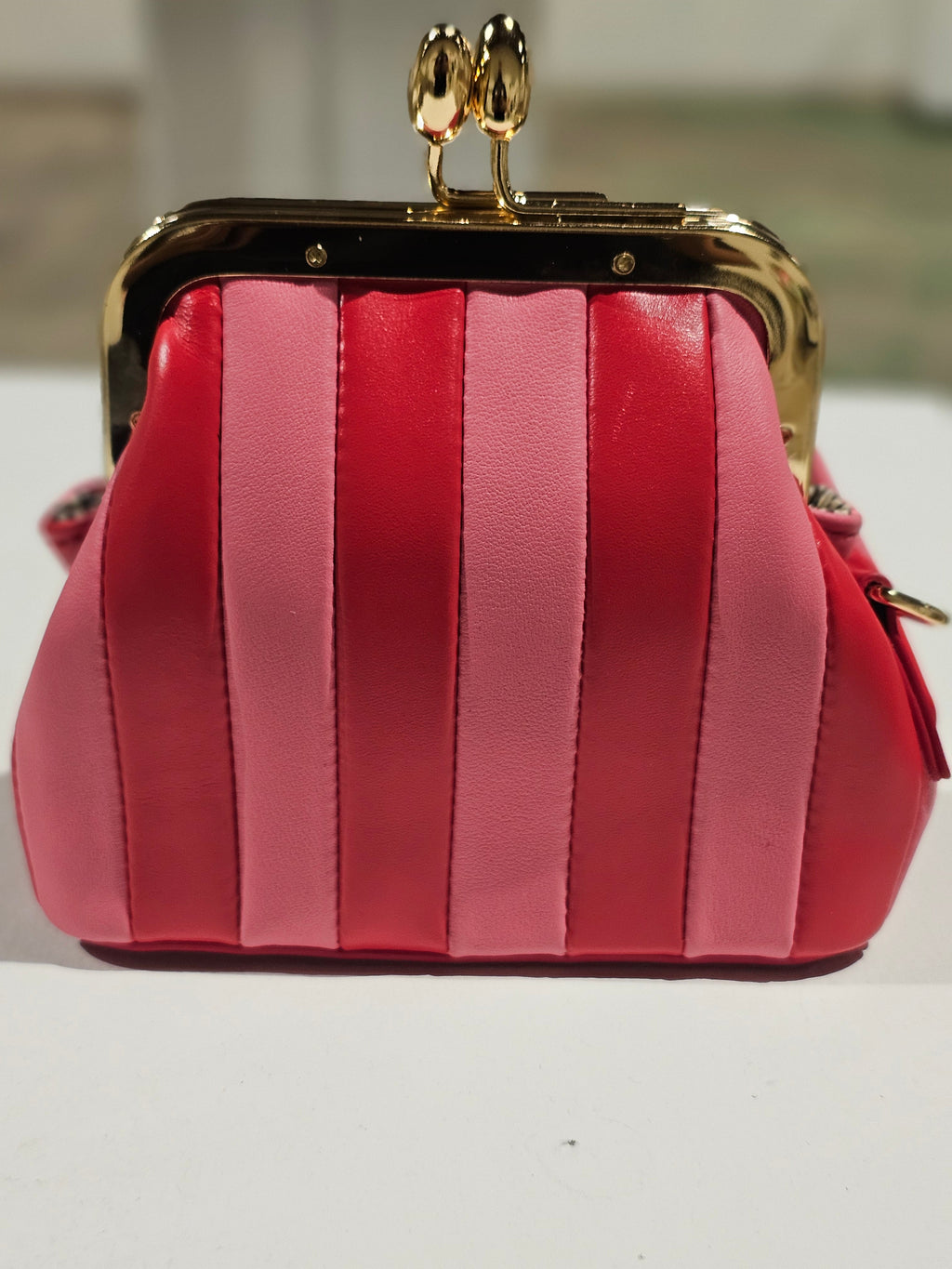 Bright red mini leather bag with gold-tone hardware