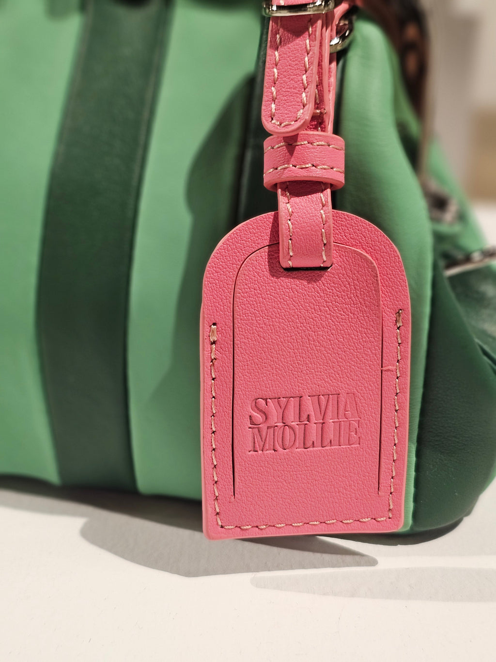 Two-tone green Lil Fannie with a crossbody strap