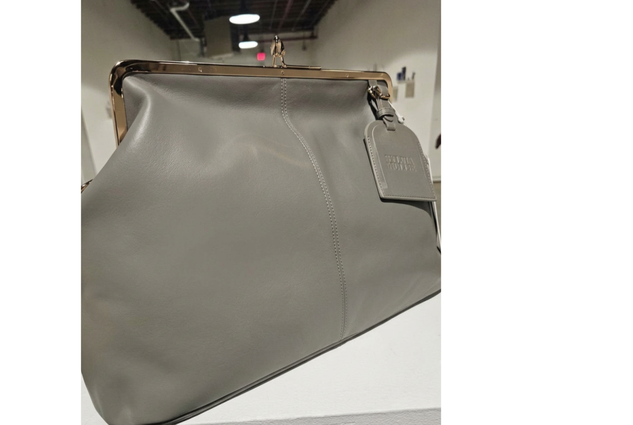 Grey kiss-lock leather handbag with a gold-tone frame