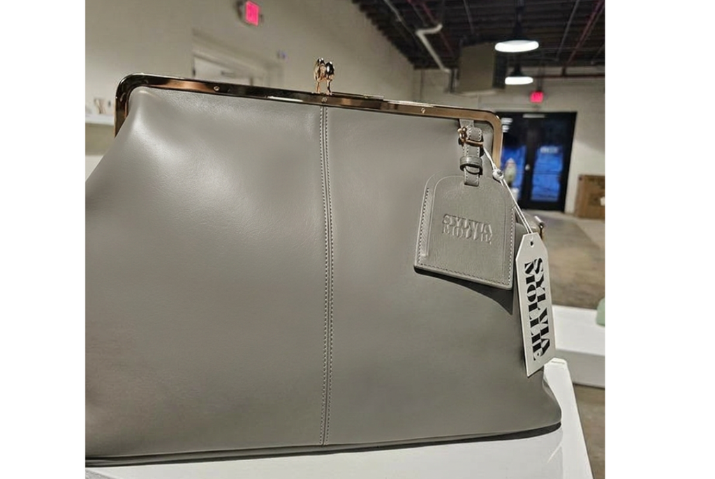 Grey leather Fannie Bag with a matching embossed hangtag