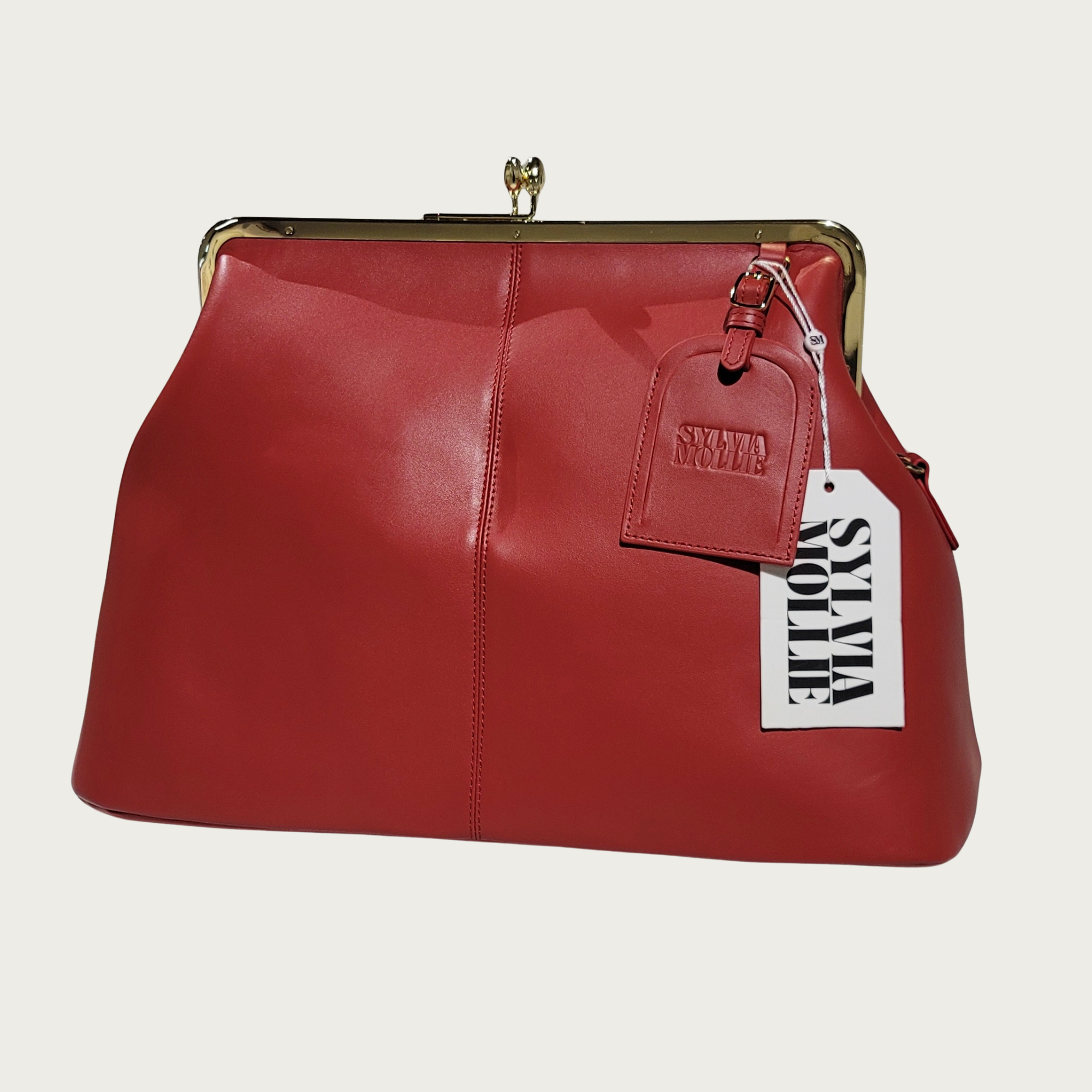 The Fannie Bag in red leather with a gold-tone kiss-lock frame