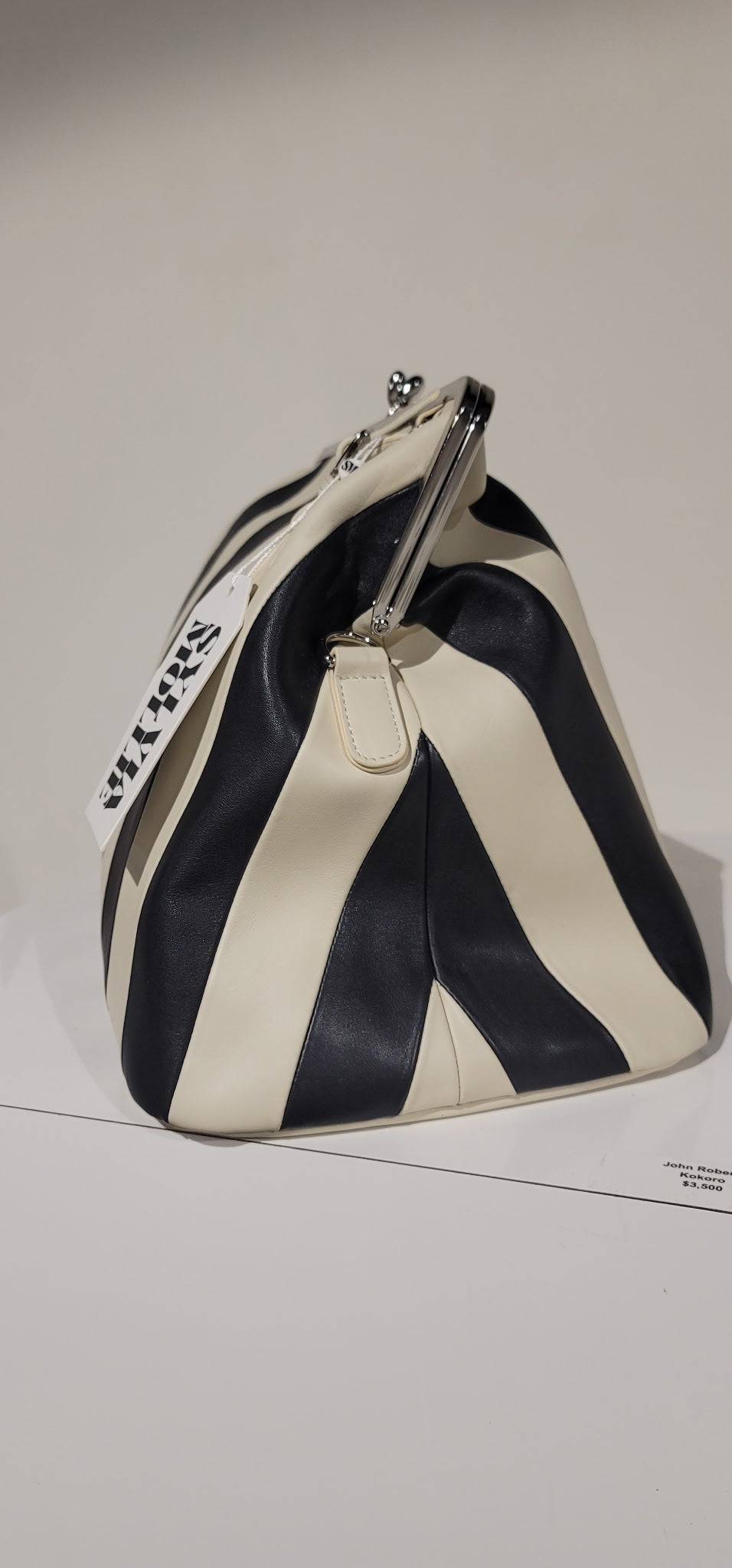 Ecru and black striped Fannie Bag with a silver kiss-lock frame