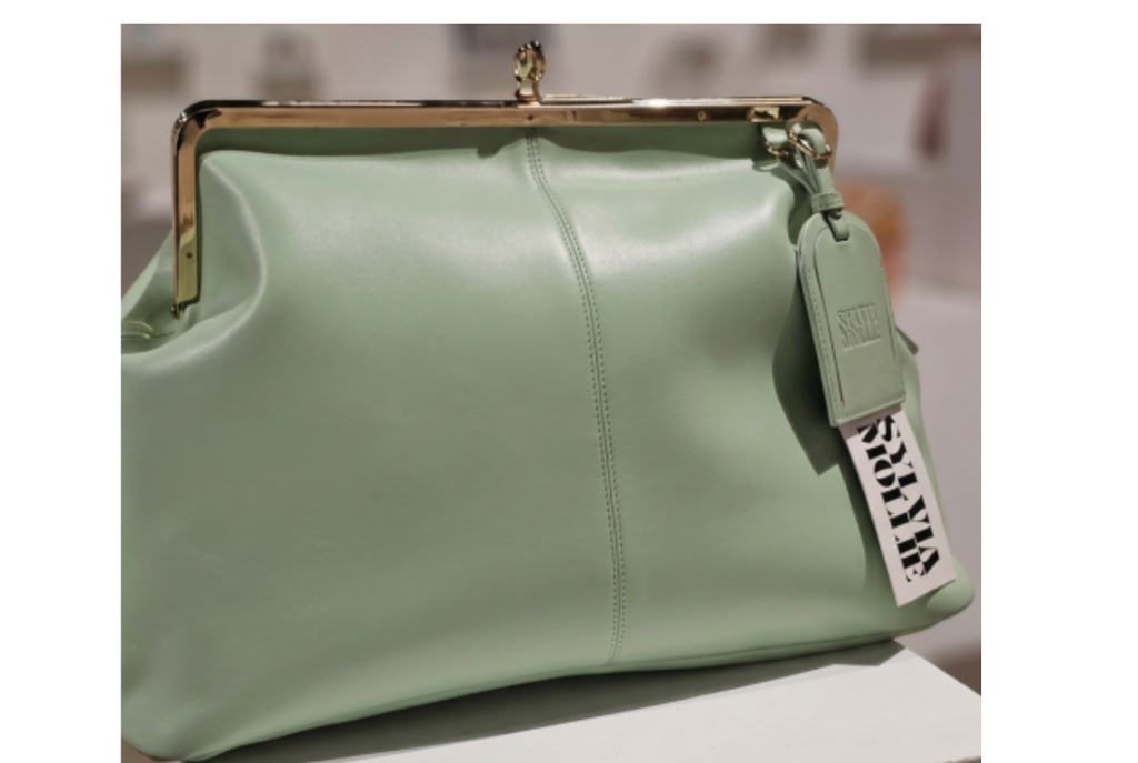 Soft mint green leather kiss-lock handbag by Sylvia Mollie