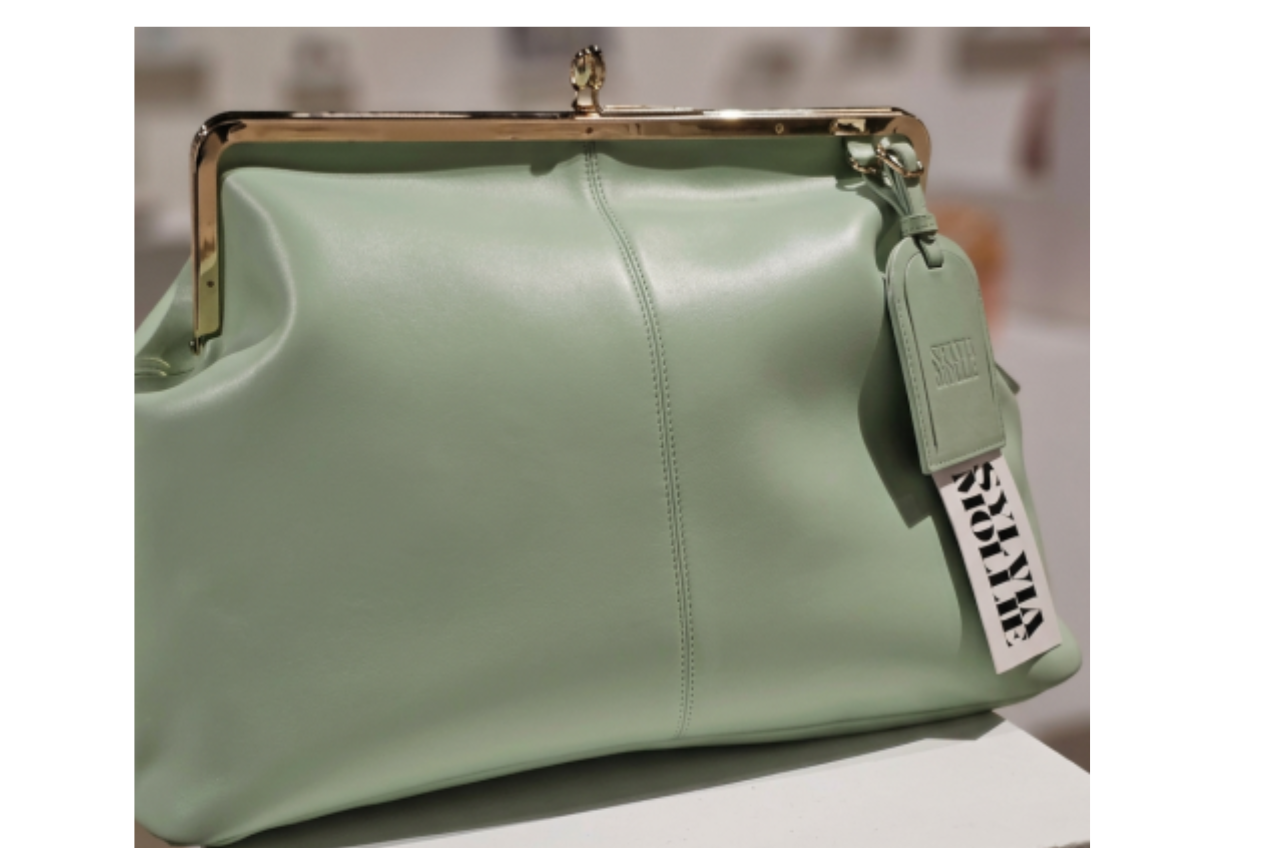 Soft mint green leather kiss-lock handbag by Sylvia Mollie